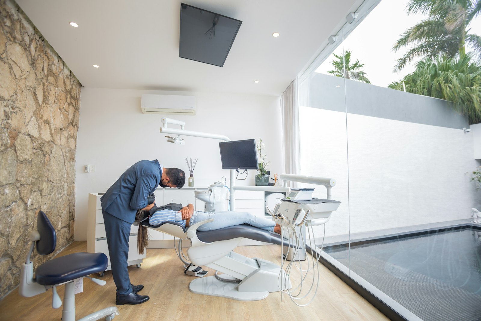 A dentist and patient discussing options at a desk
